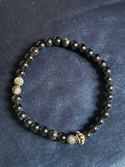 Mooie armband van zonnig goud obsidiaan